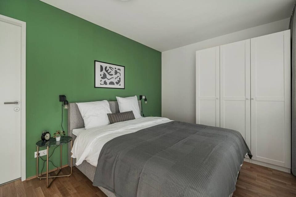 Step into the bedroom, a space envisioned by Arbio Designers, offering serenity and a cozy bed for your ultimate comfort.
