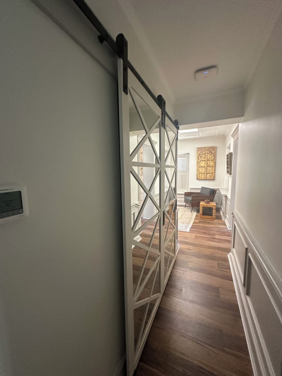 Front hall with full laundry closet for guest convenience