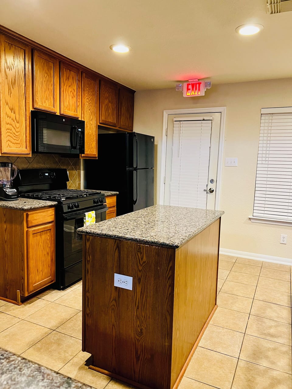Full kitchen equipped with gas stove, microwave, refrigerator, coffee maker,
