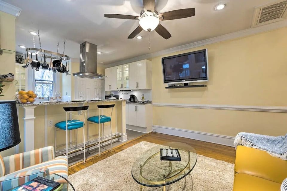 Living room, tv, bar for enjoying a meal or coffee. 