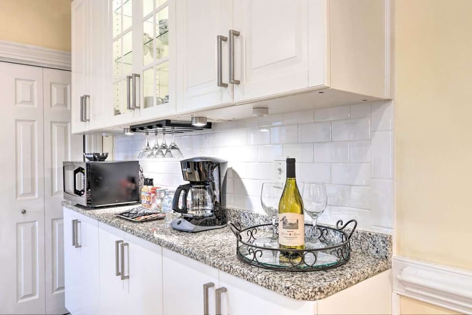 Kitchen coffee maker, toaster (missing from photo), microwave.