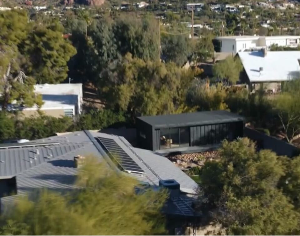 Drone view of guest house setting with Camelback in background