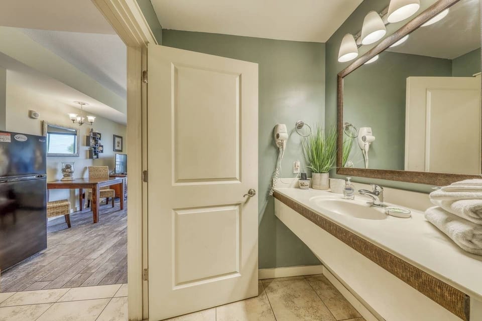 Ample counter space & large mirror + hair dryer!