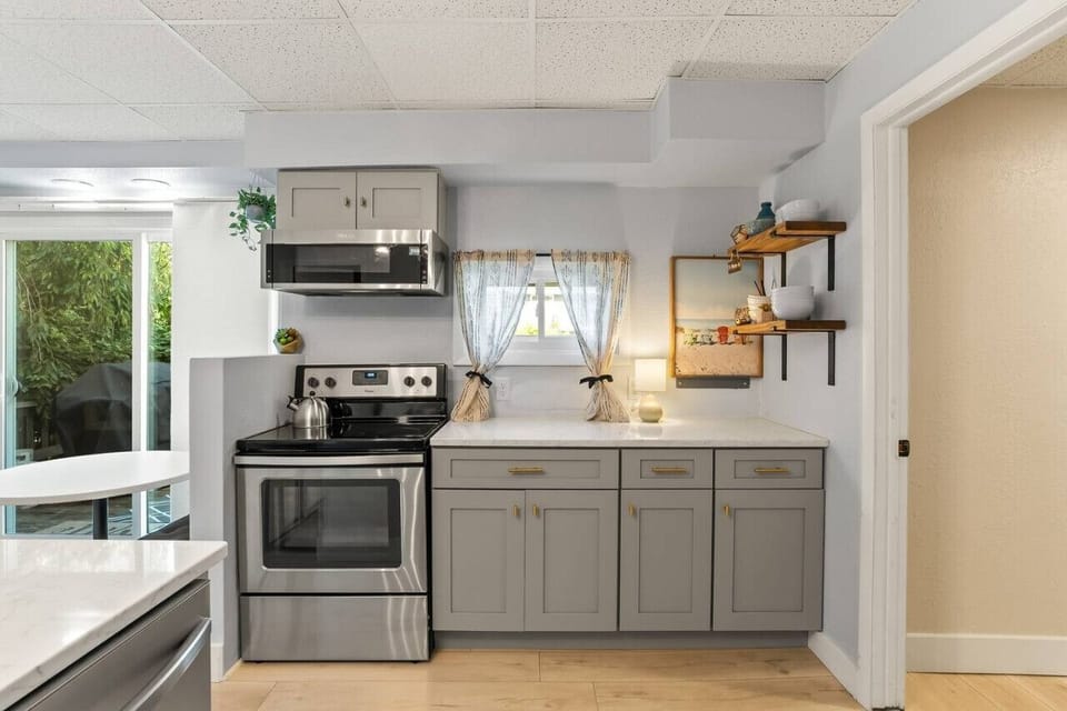Prepare your favorite meals in this inviting kitchen, where space and style make cooking feel effortless.