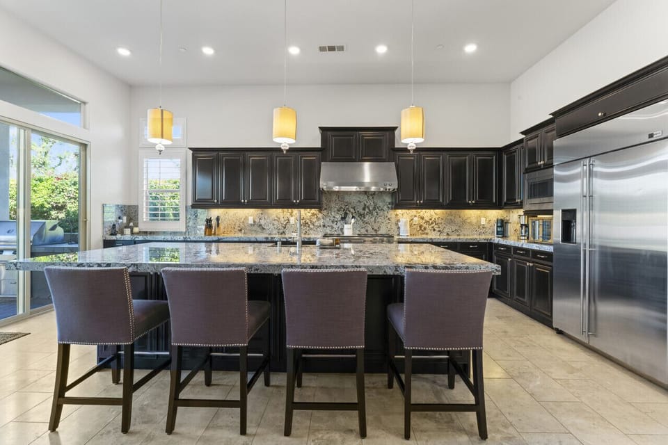 Expansive kitchen w/ island seating & ample counter space for cooking together