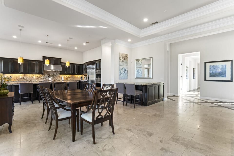 Spacious dining area flowing into the kitchen, perfect for easy group meals
