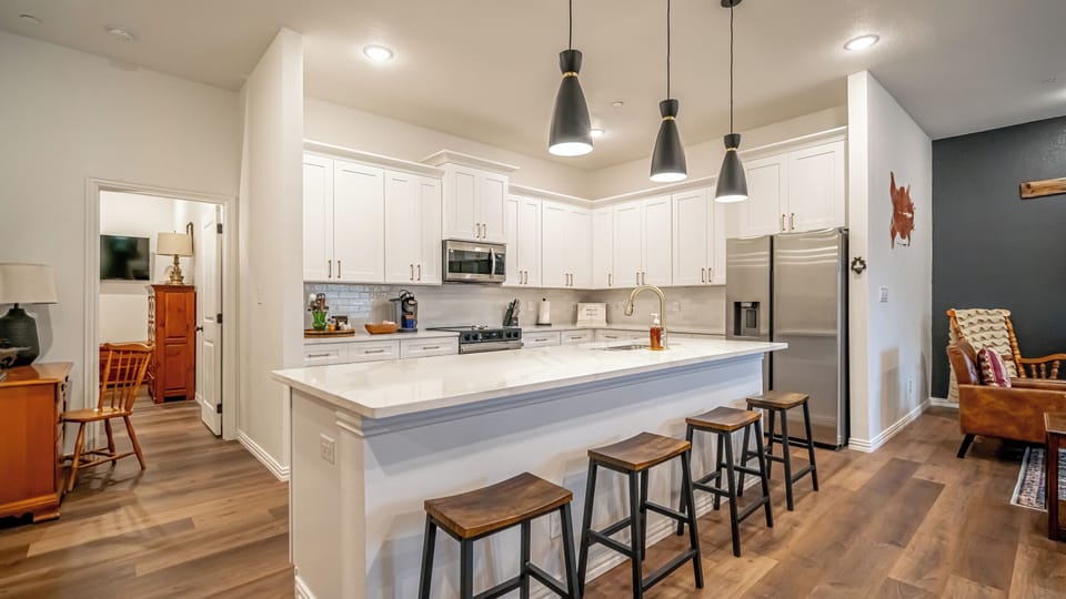 A fully equipped chef's kitchen with everything you need for a home-cooked meal or game day prep. Perfect for extended stays, family trips, and corporate housing near AT&T Stadium.