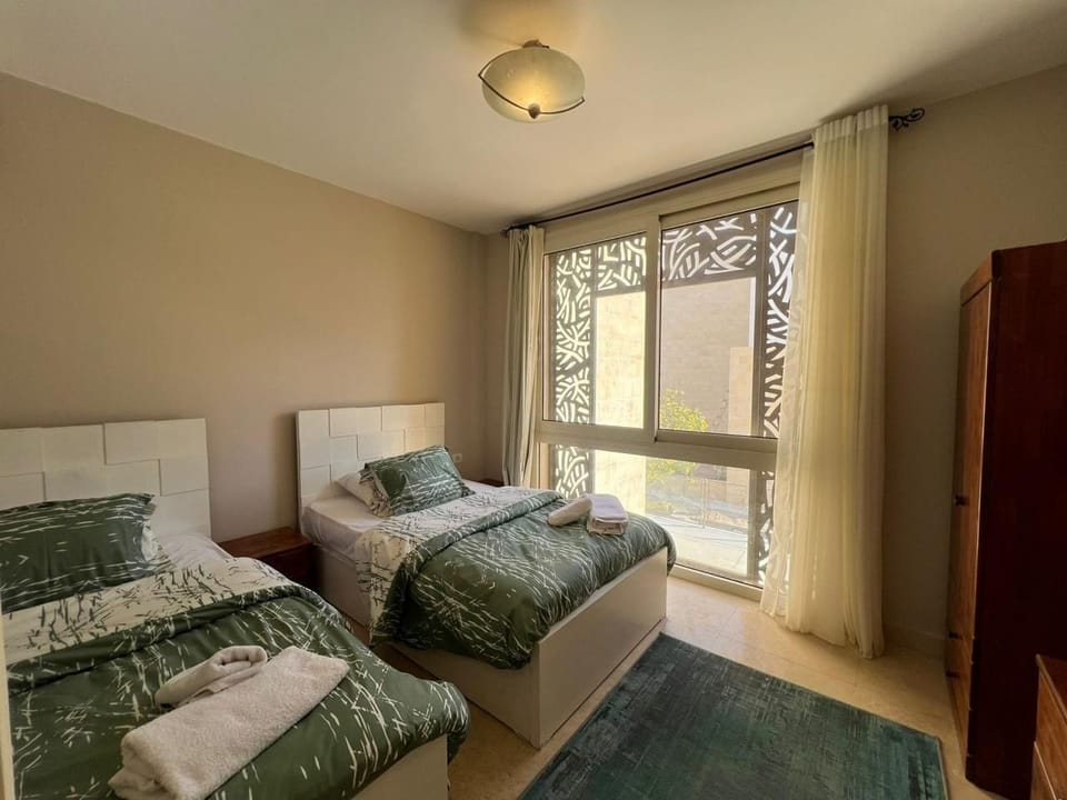 Second Bedroom
Twin bedroom with private bathroom and natural light