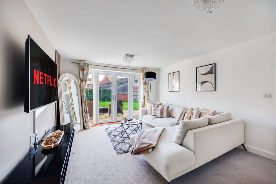 The living room features a large corner sofa and a 55'' Smart TV with Sky TV and Netflix subscriptions included