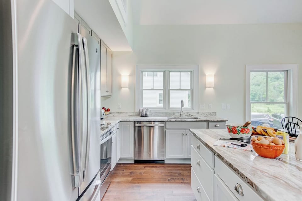 Modern kitchen with stainless appliances and granite countertops