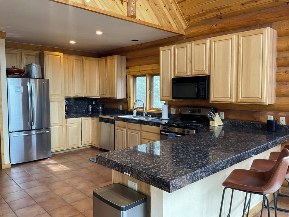 Cabinets are well stocked, and labeled, yet there's room for your groceries. 