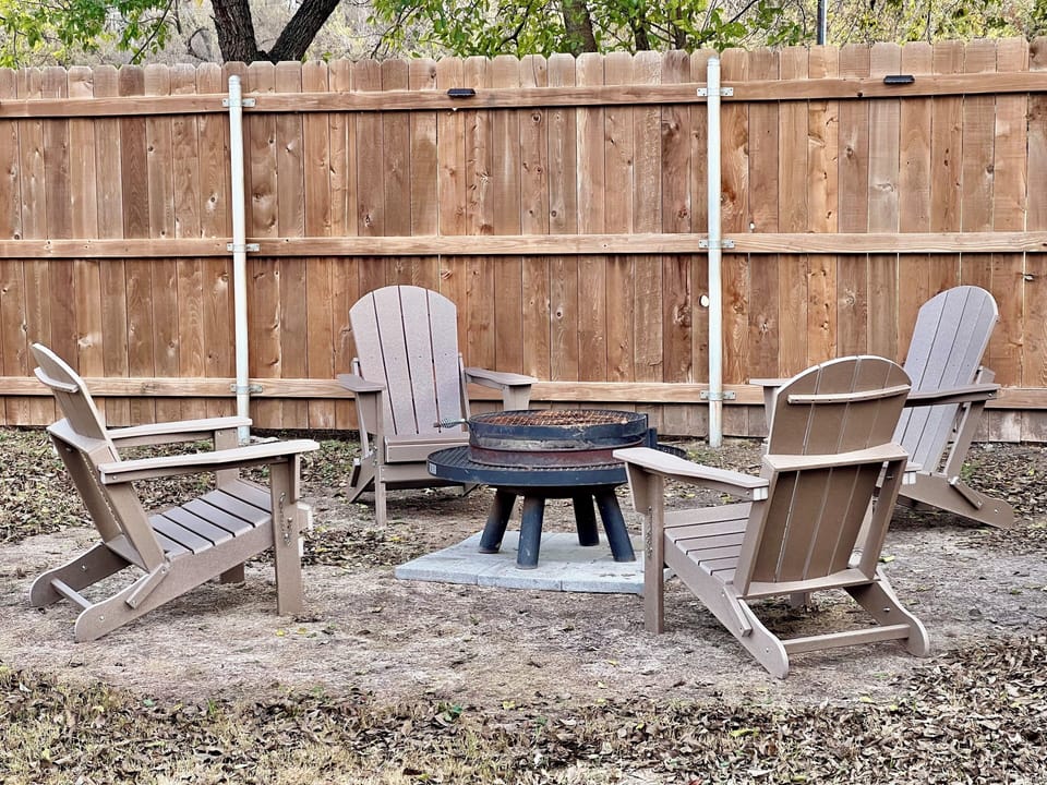 Outdoor wood-burning firepit in backyard
