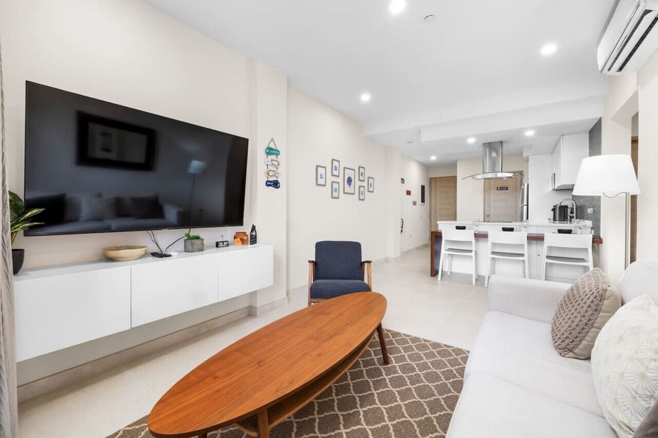 This condo`s open-concept living area offers a spacious and inviting atmosphere for ultimate relaxation.
