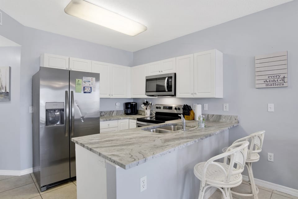 Fully equipped kitchen with granite countertops and stainless steel appliances