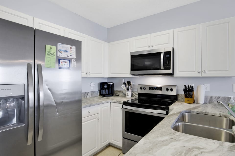 Fully equipped kitchen with granite countertops and stainless steel appliances