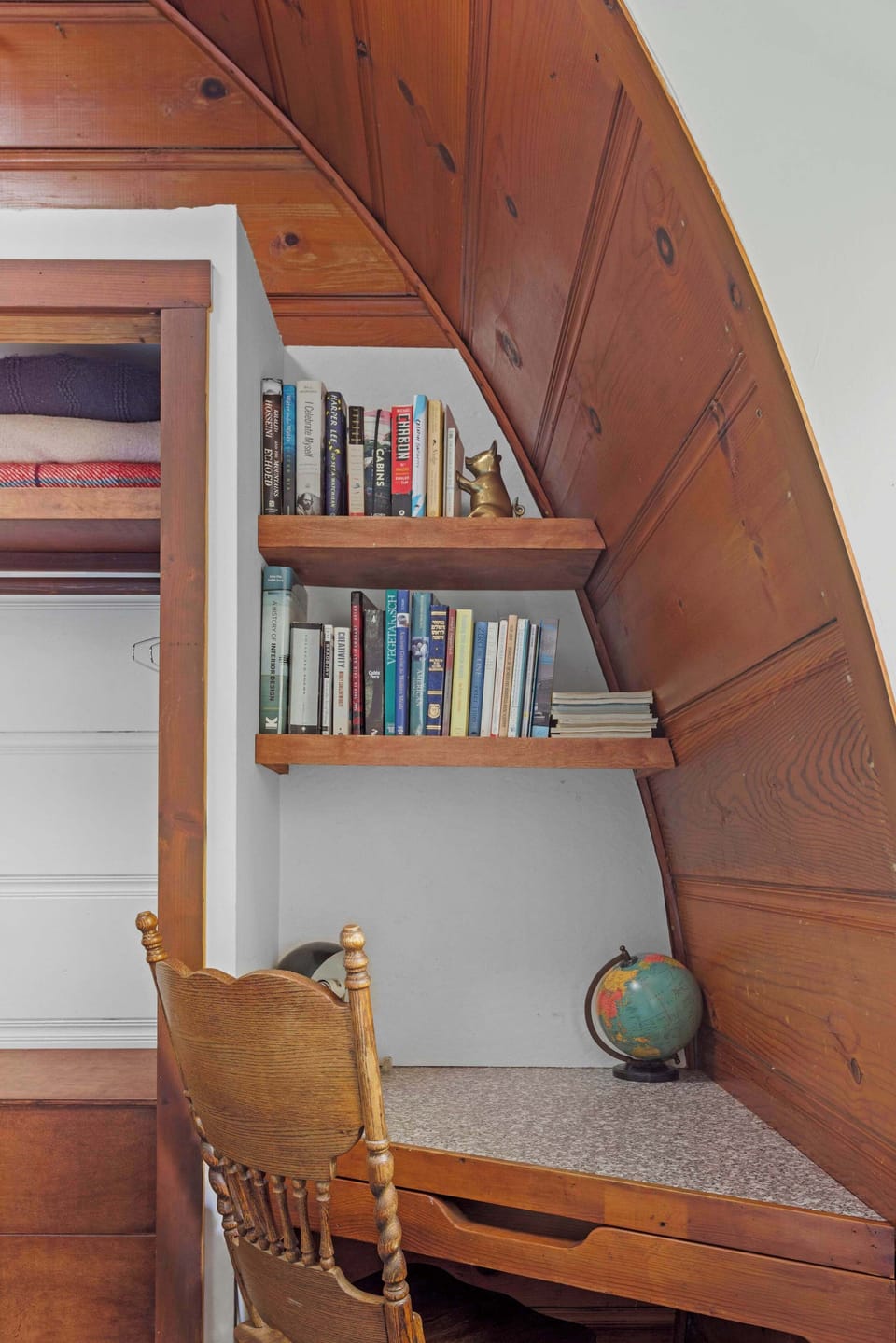 The adorable built-in desk along with a dresser and loft in the first bedroom complete the space. 