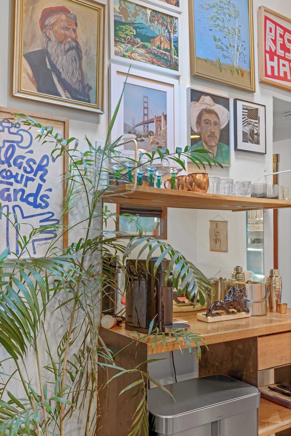 Enjoy the adorable mini bar set in an eclectic gallery wall. Real plants and redwood views make the Eclectic Escape a destination in itself. 