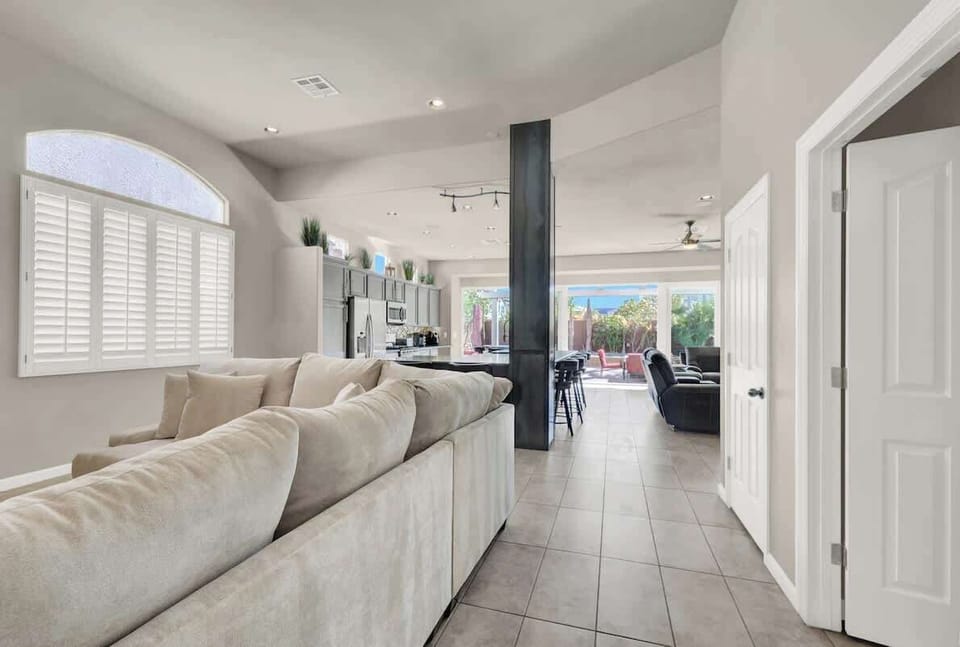 Kick back and relax in a spacious living room made for comfort and entertainment.