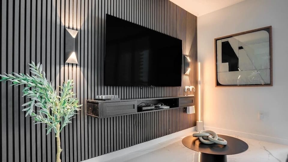 Large Smart TV with PS5 attached.