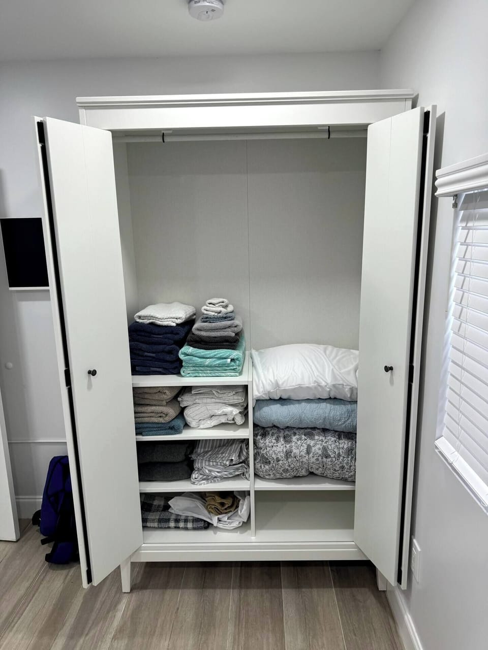 Keep your stay comfortable with this conveniently stocked linen closet, offering fresh towels and extra linens for your convenience.