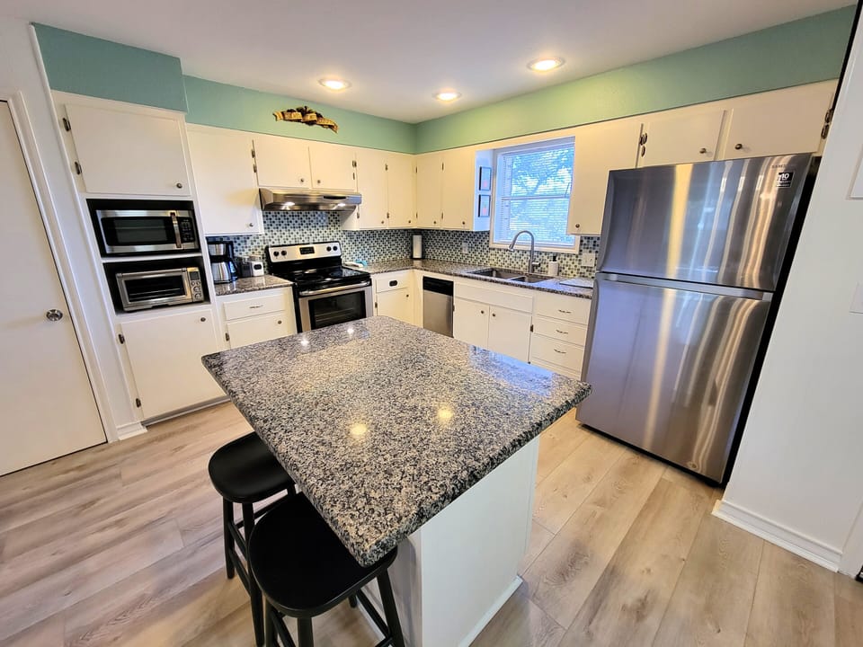 Fully stocked kitchen will satisfy all your cooking needs.