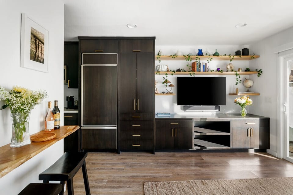 Cozy living space featuring a TV and elegant decorative accents.