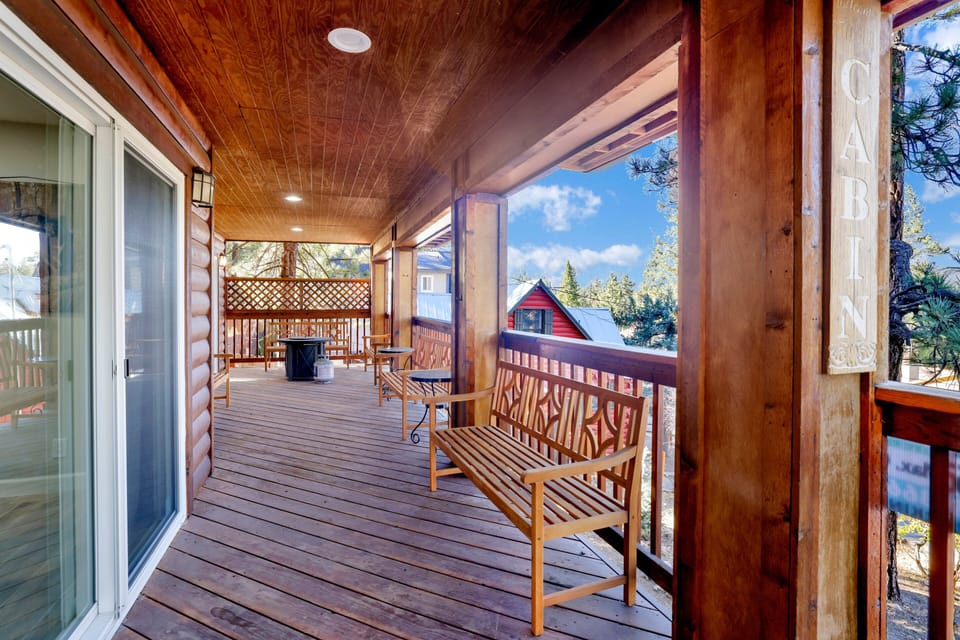 Front porch area with seating and a fire pit to enjoy a relaxing evening.