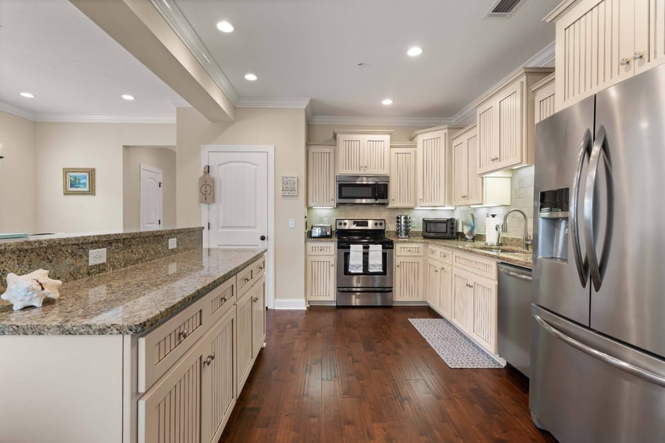 The large open kitchen is stocked with everything you'd find in your own kitchen (or maybe more).