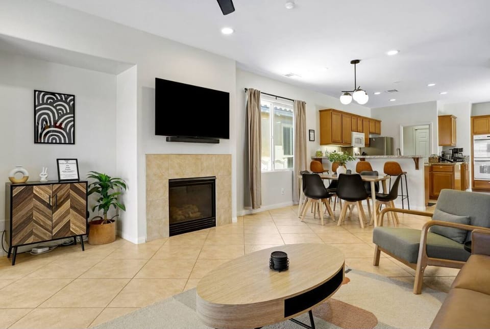 Bright and open living space with comfy sofa and smart TV.