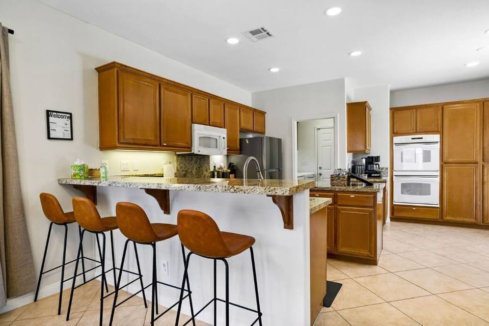 Comfortable bar seating just steps from the kitchen action.