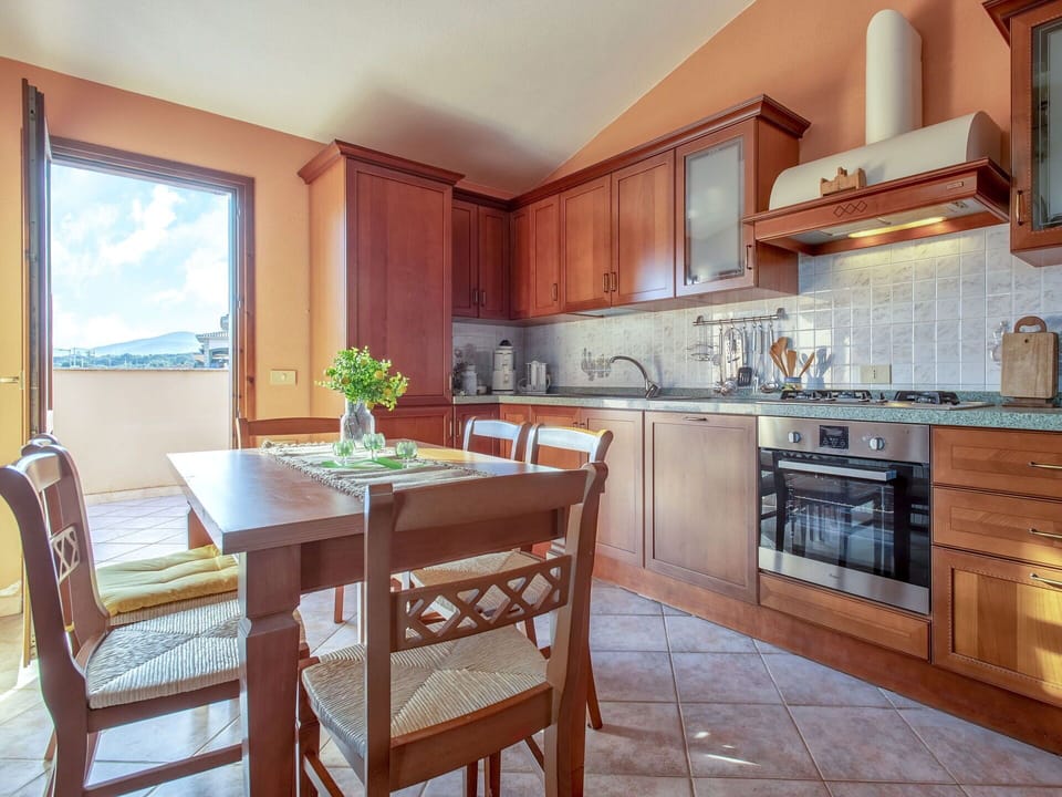 Countertop, Cabinetry, Property, Furniture, Table, Wood, Kitchen Appliance, Chair, Interior Design, Kitchen