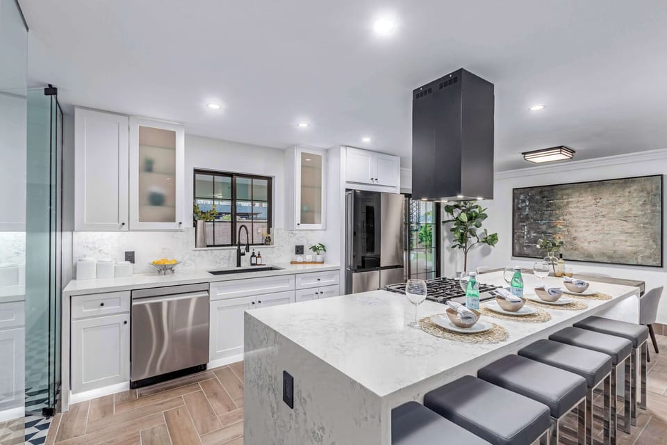 Updated kitchen with stainless steel appliances and gas cooktop