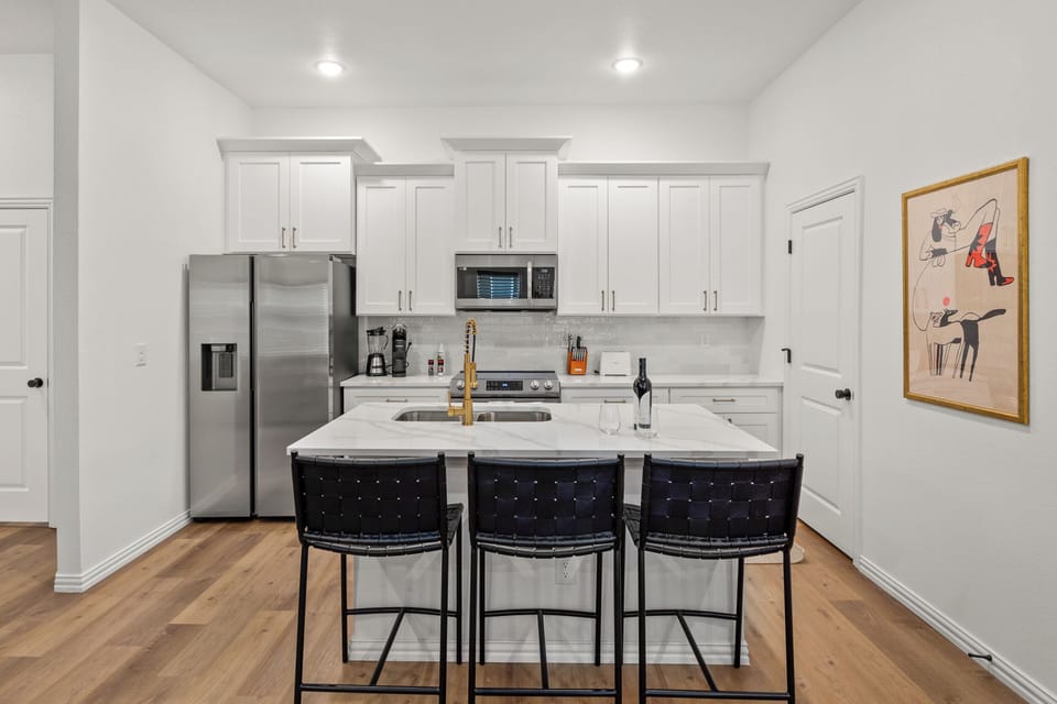 A fully equipped chef's kitchen with everything you need for a home-cooked meal or game day prep. Full-size appliances, cookware, utensils, and counter space to spare — because not every great meal should come from DoorDash.