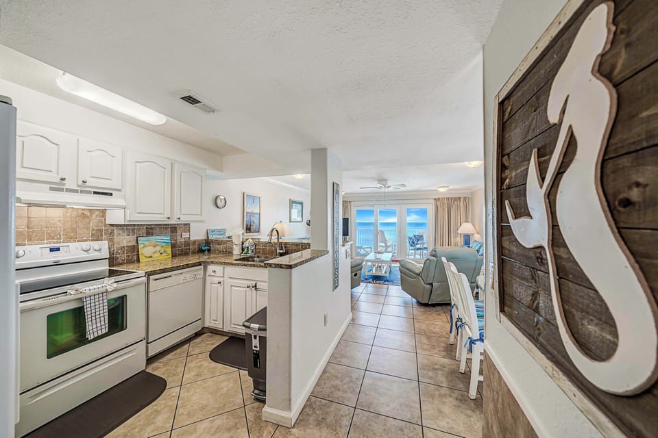 The fully equipped kitchen features granite countertops and has everything you need to prepare meals for family & friends.