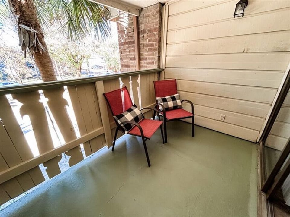 Step outside to enjoy the natural light and fresh air from the balcony.