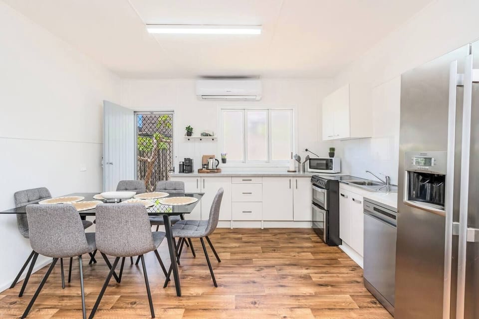 A dining table seats all six guests for meals at home.