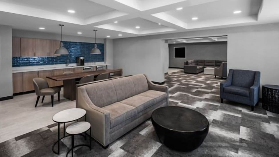 Gather comfortably in the spacious lounge with modern seating.