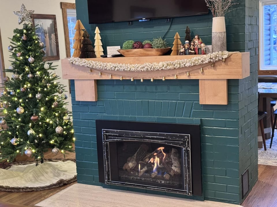 Cozy living room with festive fireplace and holiday charm