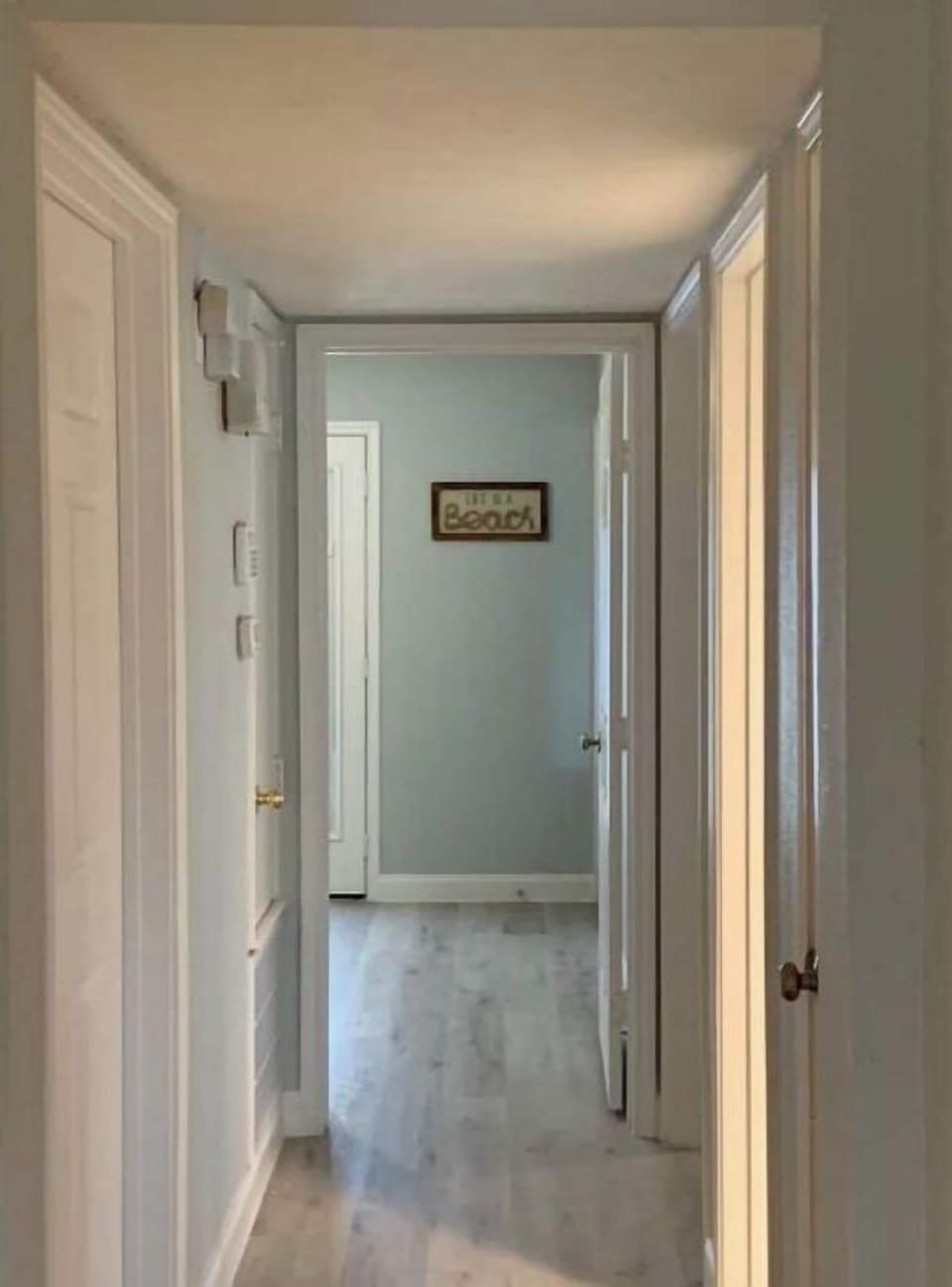 Hallway to bedrooms and linen closet