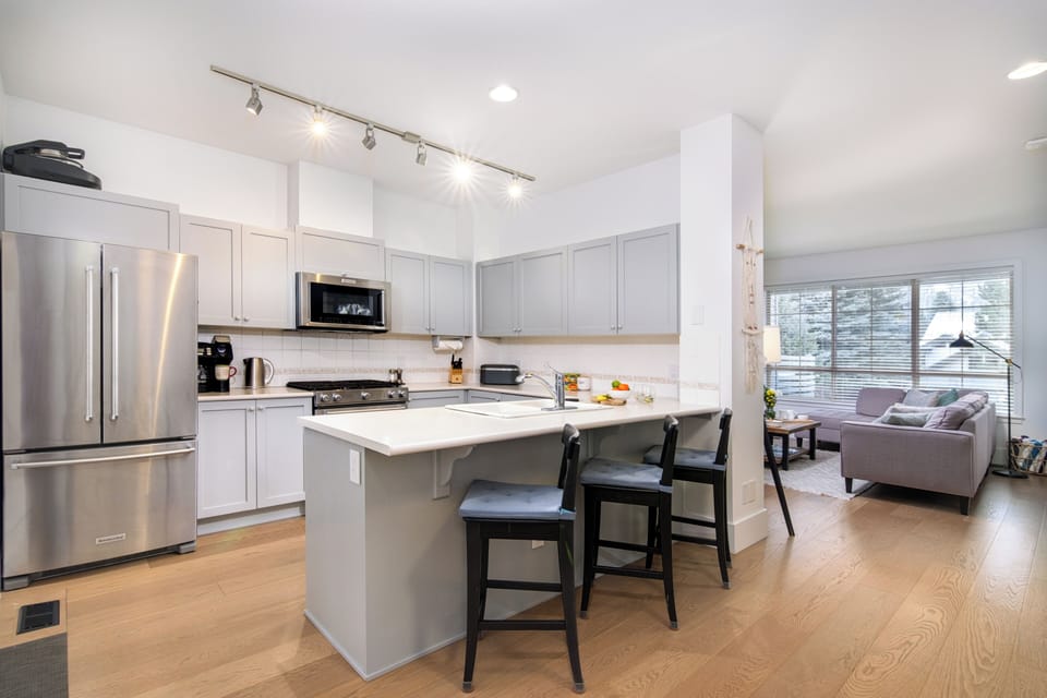 Spacious, fully equipped kitchen with modern appliances and ample counter space.