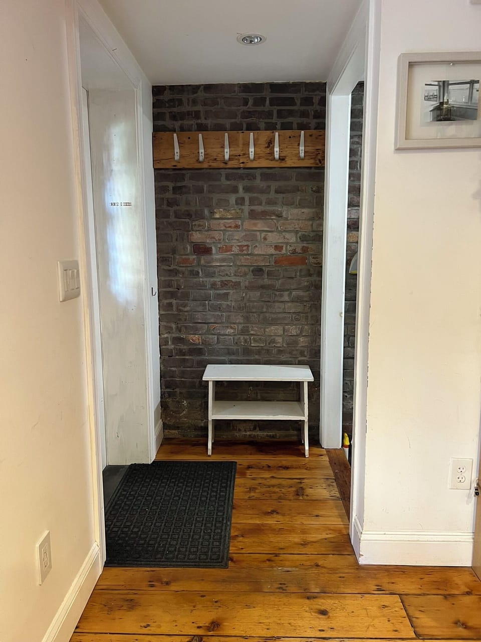 Entry, stairs on right, down to laundry in cellar.