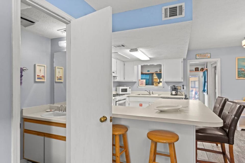 Inviting bathroom located next to kitchen for convenience.