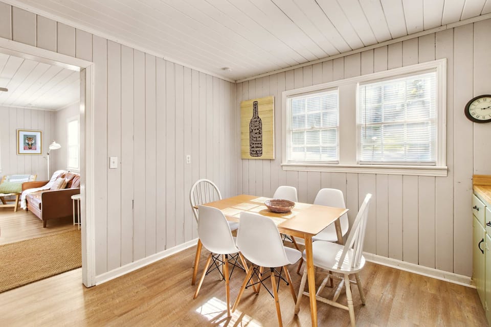 Bright and inviting dining space with natural light and charming decor, perfect for family meals.
