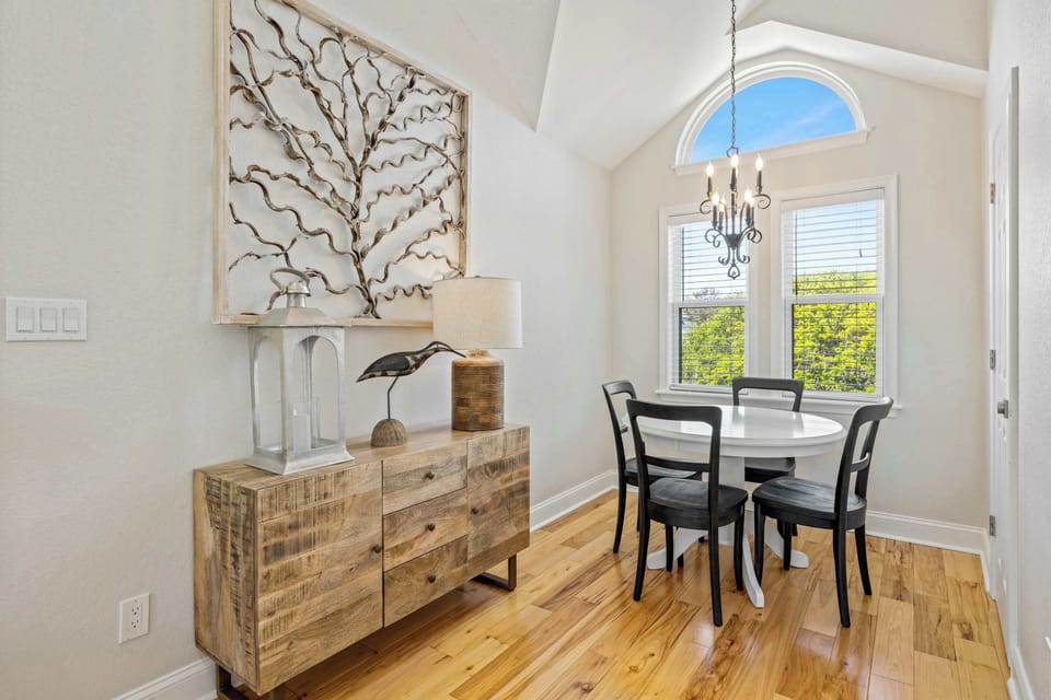 Extra Dining Area w Chandelier, Wood Sideboard, Wall Art and Seating for Four