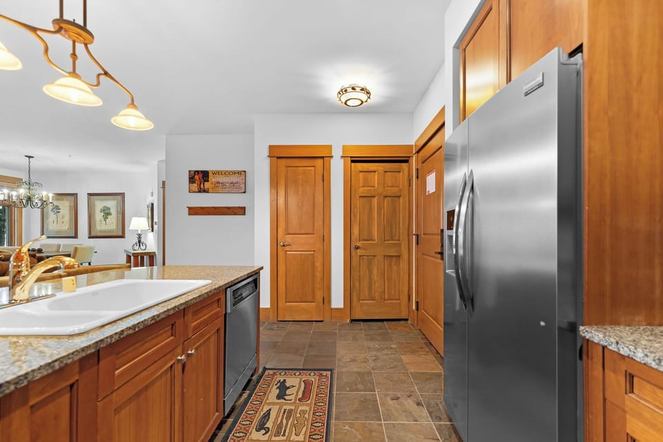 Your fully equipped kitchen features granite counters, stainless appliances, and warm wood cabinets for home-style meal prep.