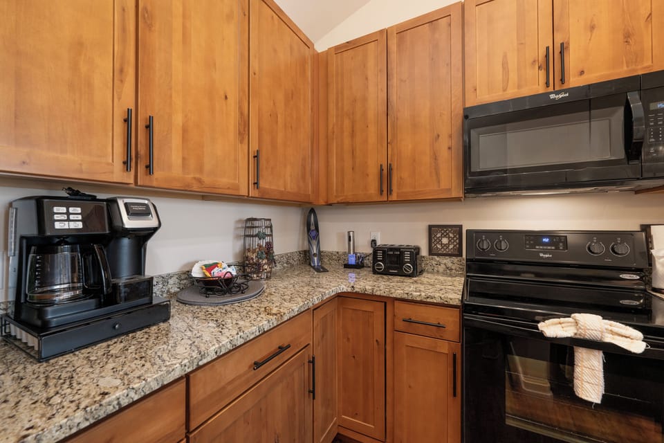 Your fully equipped kitchen makes home-cooked meals effortless with granite counters, stainless appliances, and thoughtful amenities.