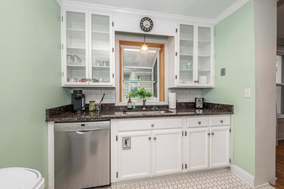 The bright, airy kitchen offers ample space & all the comforts of home