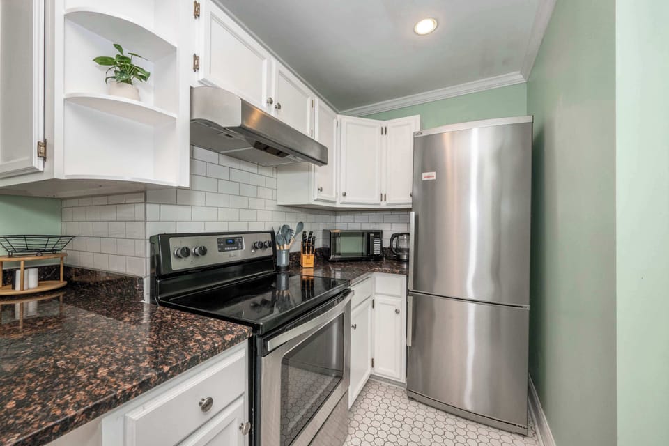 The bright, airy kitchen offers ample space & all the comforts of home