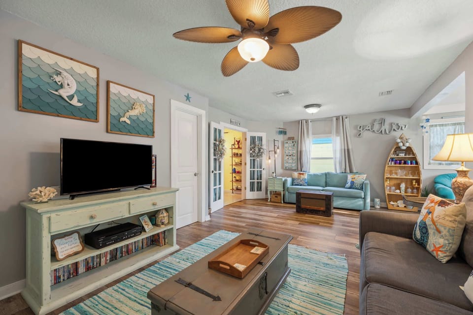 Bright living area with ample seating and Smart TV