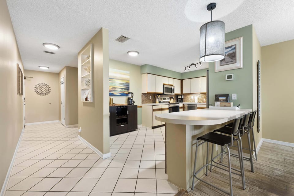 Sip morning coffee or grab a bite at the kitchen counter, with seating for 3